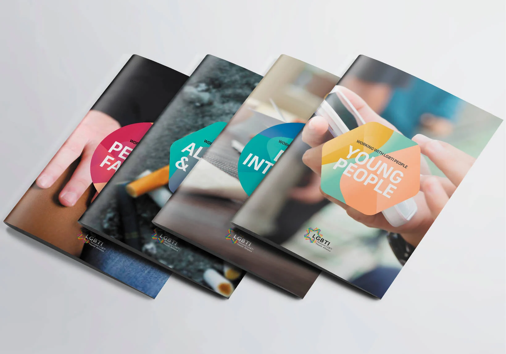 Fan of four educational brochures designed for LGBTIQ+ Health Australia, featuring color-coded covers for topics including Young People, Intimate Partner Violence, and Family Support.