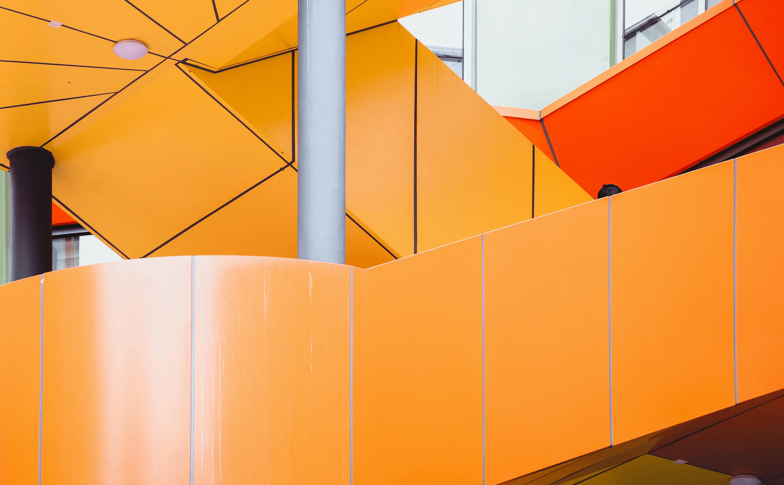 Abstract geometric design featuring vibrant orange tones, reflecting creative brand and visual identity work